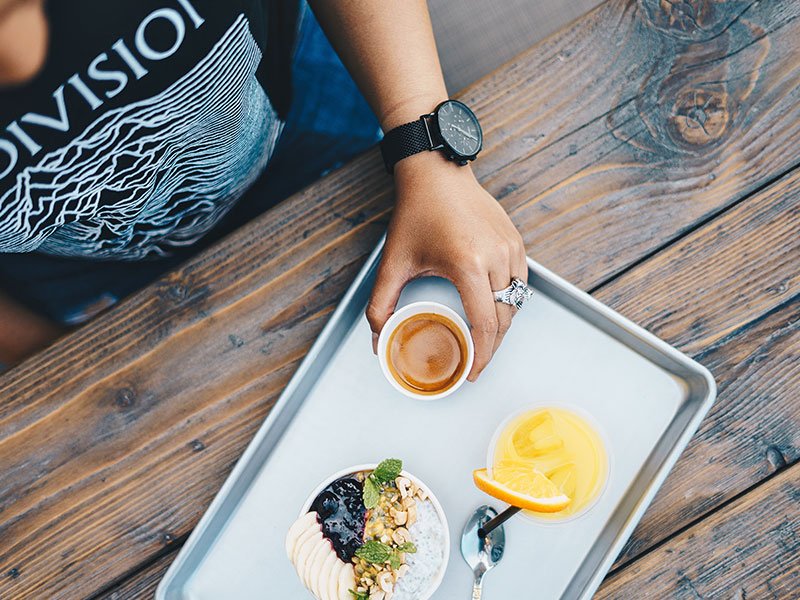 Person Sitting with Breakfast Tray Person Sitting with Breakfast Tray